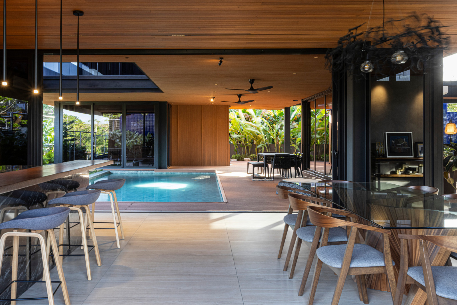 The entertaining area and pool of the Halcyon House in Alabang, Manila by Barchan + Architecture