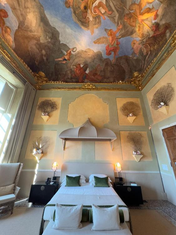 A beautifully-appointed room at the Palazzo Durazzo Suites