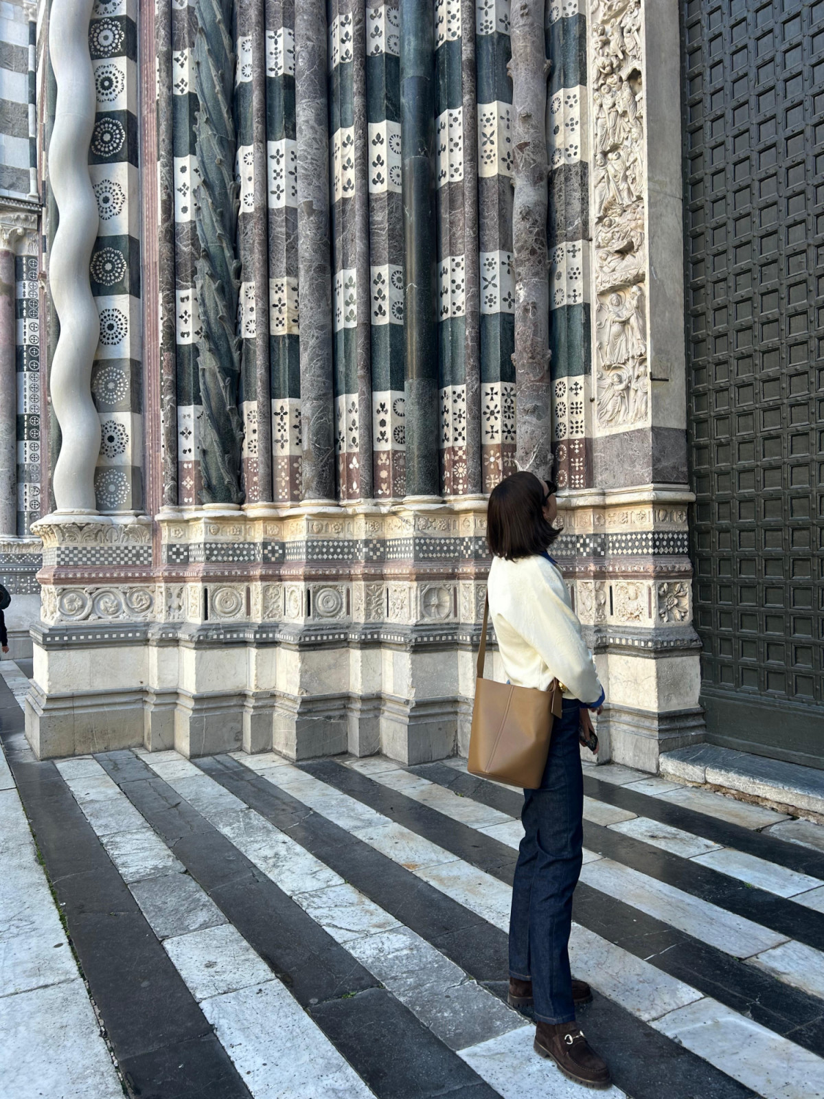 Hilton examines the architecture of the San Lorenzo Cathedral in Genoa