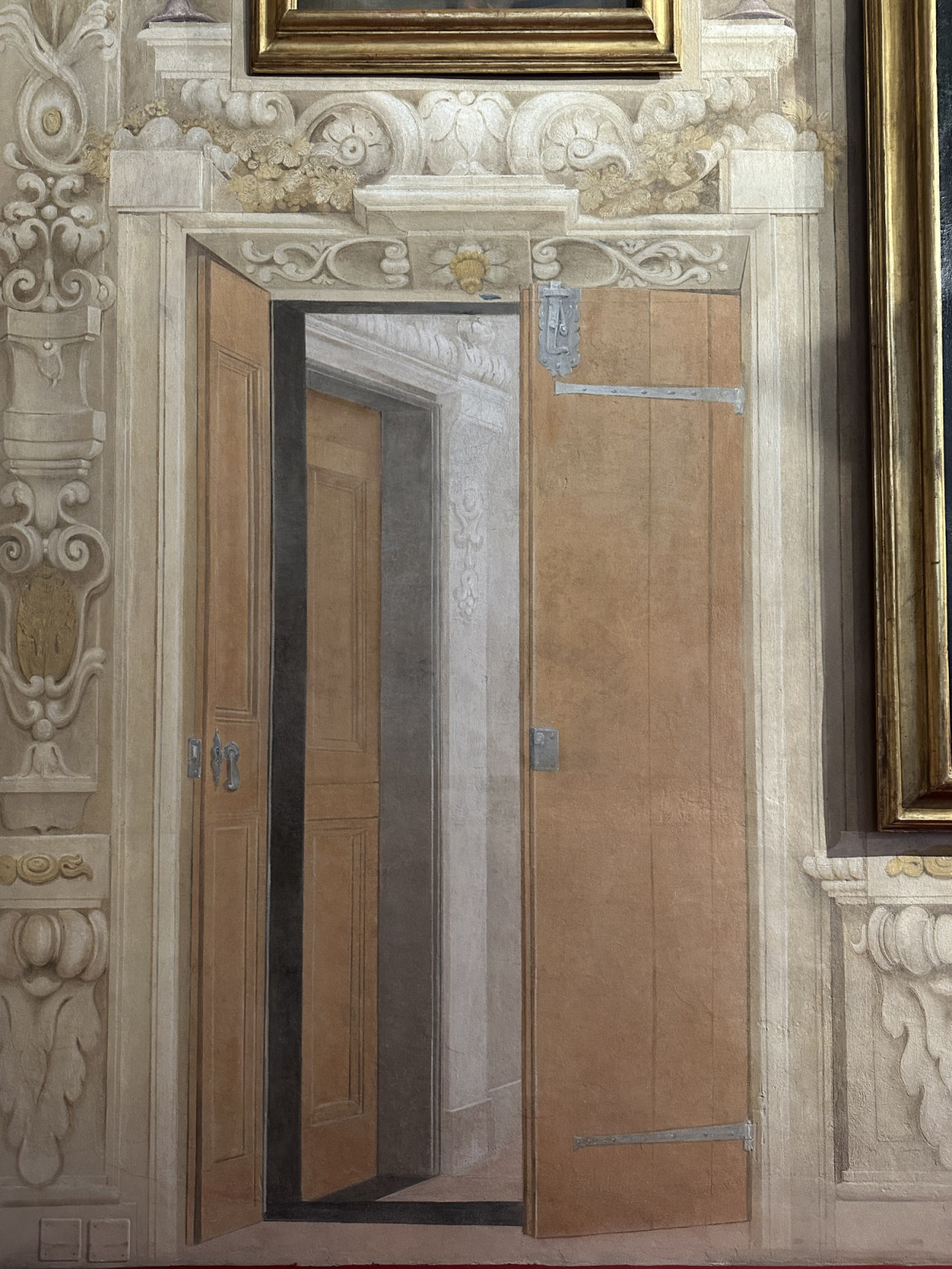 Frescoed walls adorned with trompe l’œil at the Palazzo Rolli in Genoa, Italy