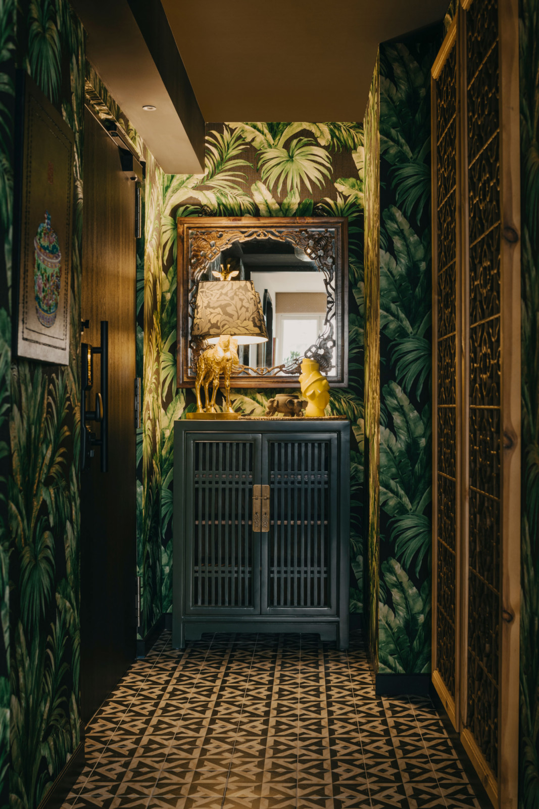 Upon entering, the foyer creates a darker and more dramatic sense of arrival