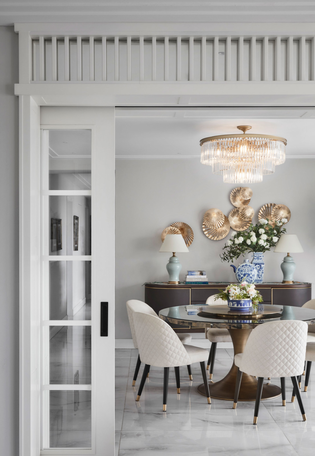Despite also being Art Deco-inspired, this apartment leans more contemporary with a soft colour palette