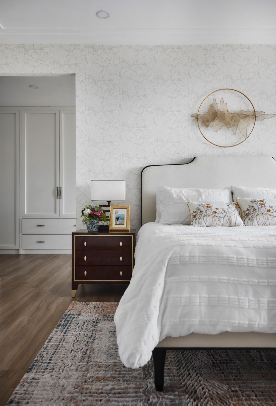 The soothing bedroom makes use of a soft, neutral palette to create an intimate atmosphere