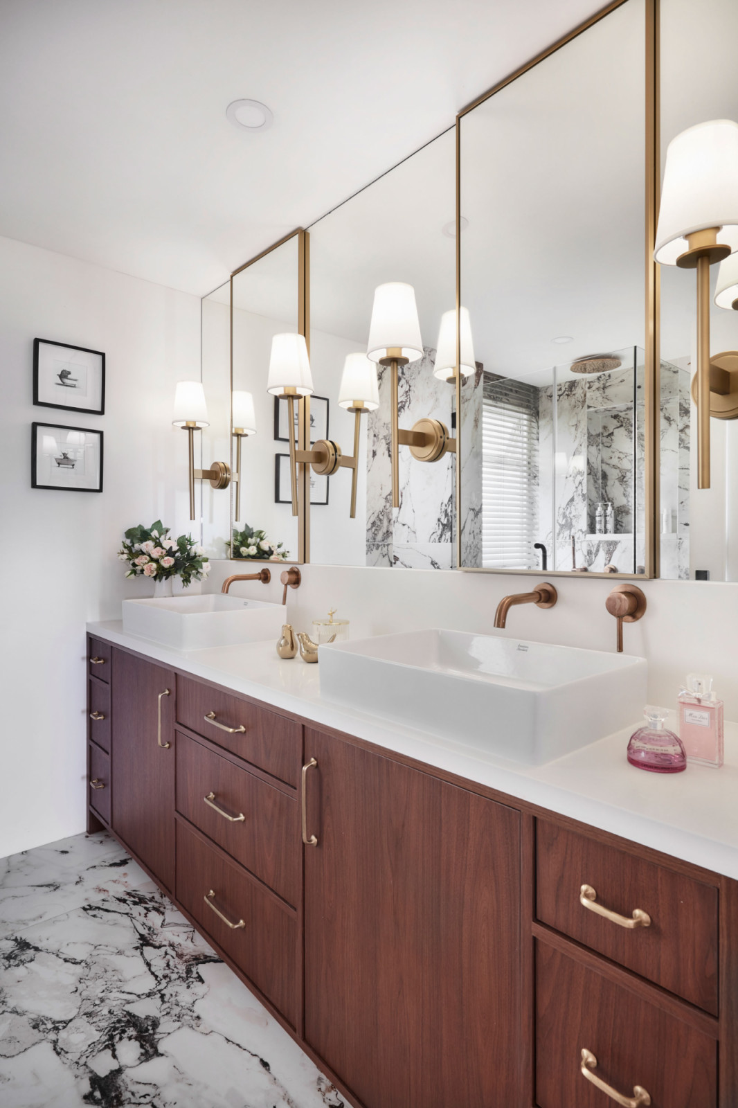 This bathroom sees subtle Art Deco influences blended with more contemporary fittings