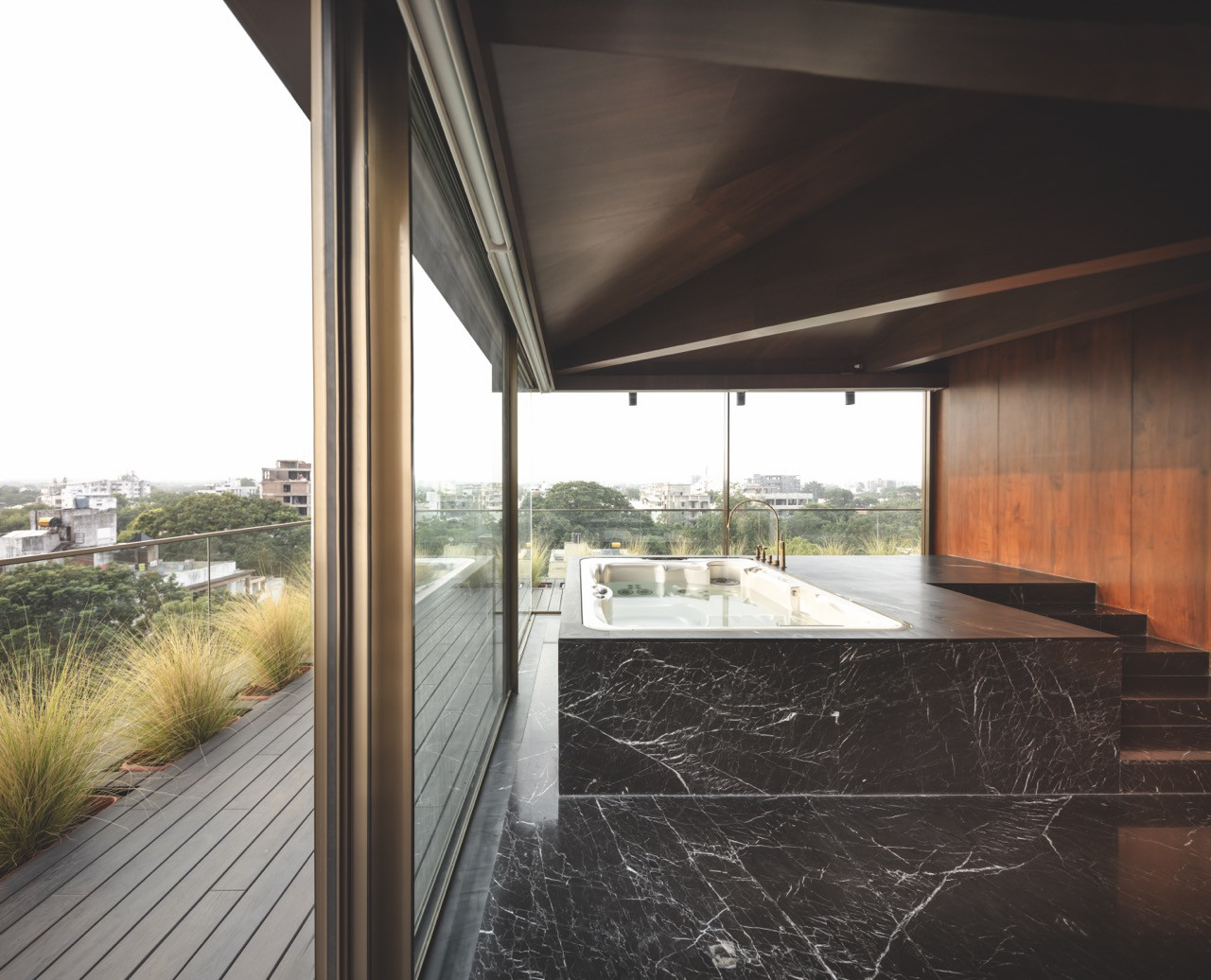 The material palette is warm and organic, yet sleek