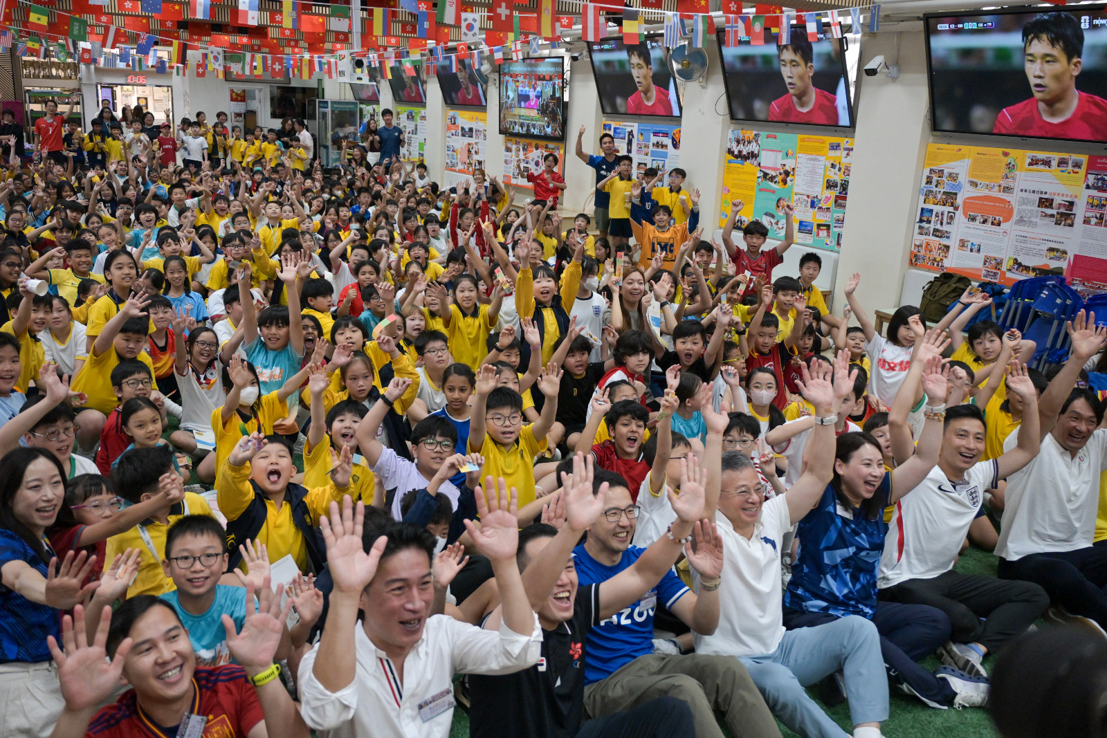 Students and teachers watch the live broadcast of the group A match between South Korea and the Czech Republic during the 2026 FIFA World Cup at a World Cup Carnival at Po Leung Kuk Lam Man Chan English Primary School in To Kwa Wan on June 12, 2026 in Hong Kong, China. Po Leung Kuk Lam Man Chan English Primary School hosted a World Cup carnival on June 12, inviting guests, teachers, and students to come together to watch World Cup matches. (Photo by Chen Yongnuo/China News Service/VCG via Getty Images)