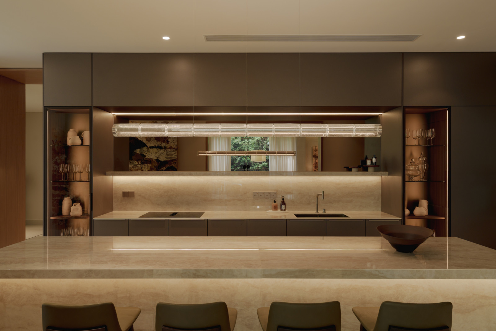 The kitchen at Eden Taman Duta’s show unit features a green marble island and Gaggenau appliances within a Poggenpohl kitchen system