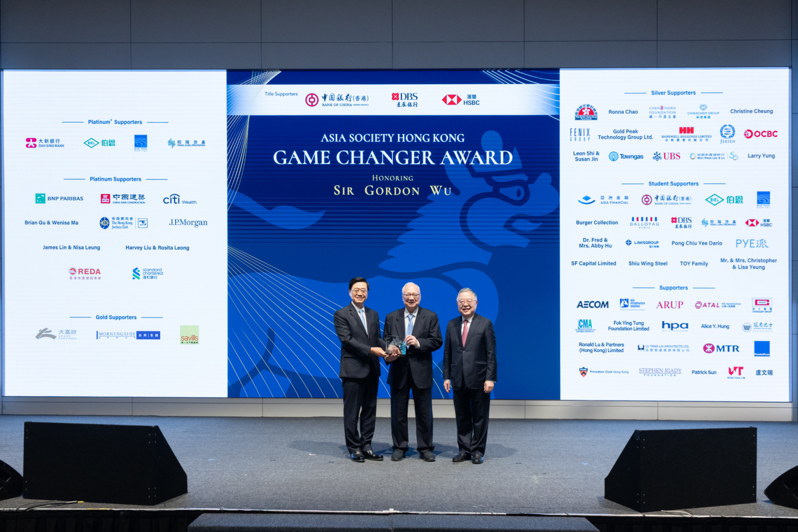 From left: John Lee, chief executive of the Hong Kong Special Administrative Region; Gordon Wu, founder and chairman of Hopewell Holdings; Ronnie C. Chan, honorary chair of Hang Lung Group and its subsidiary, Hang Lung Properties, and chair emeritus of the Asia Society and chairman of its Hong Kong centre. (Photo: Asia Society Hong Kong)