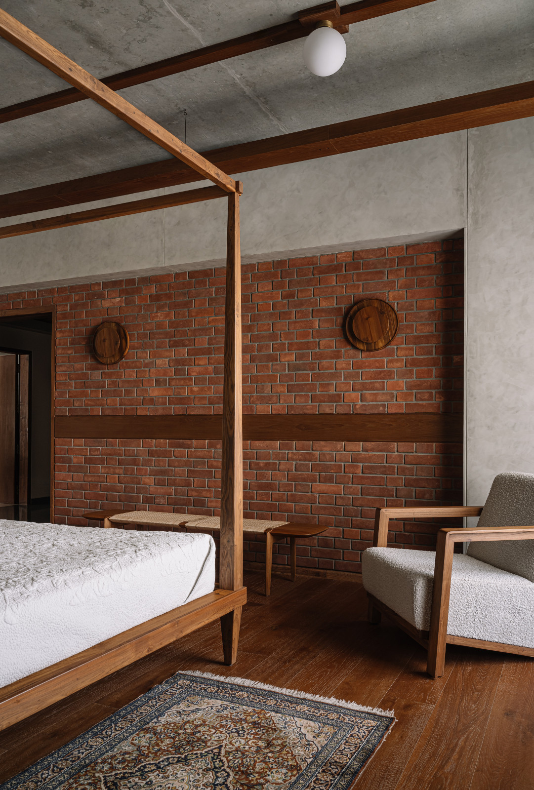 The primary bedroom in a Corbusian-inspired family apartment in Ahmedabad, India, designed by Studio Saransh