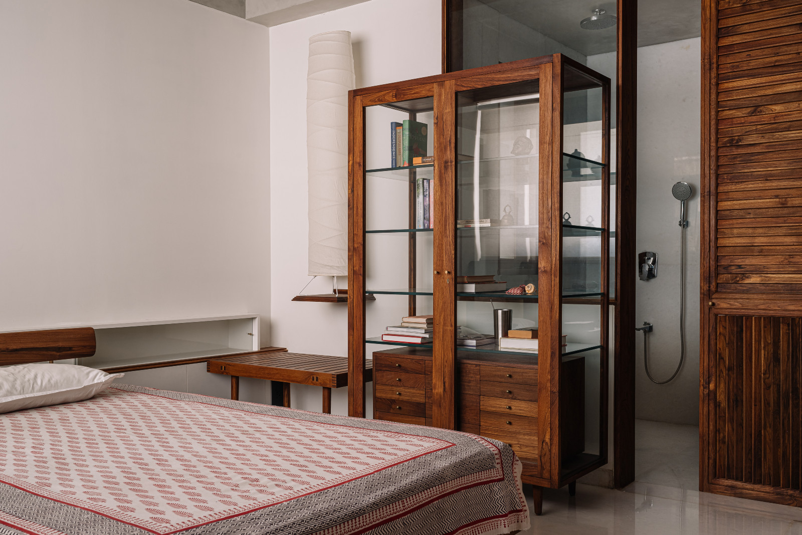 The primary bedroom in a Corbusian-inspired family apartment in Ahmedabad, India, designed by Studio Saransh