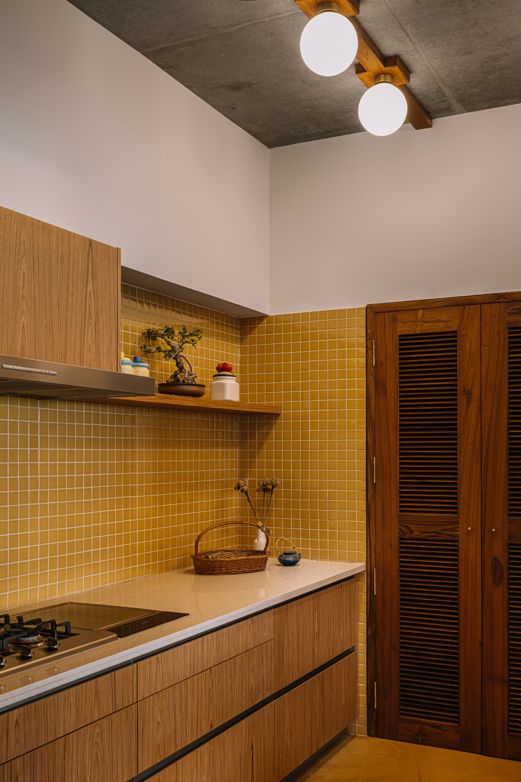 The kitchen in a Corbusian-inspired family apartment in Ahmedabad, India, designed by Studio Saransh