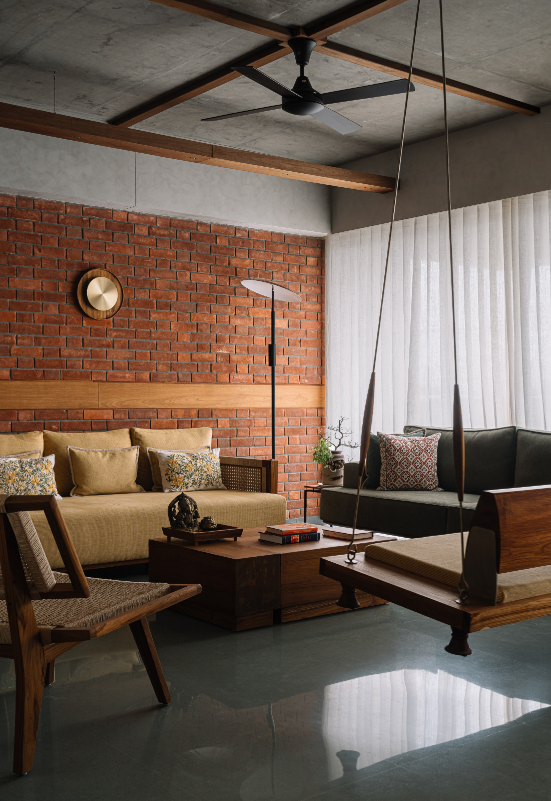 The living room in a Corbusian-inspired family apartment in Ahmedabad, India, designed by Studio Saransh