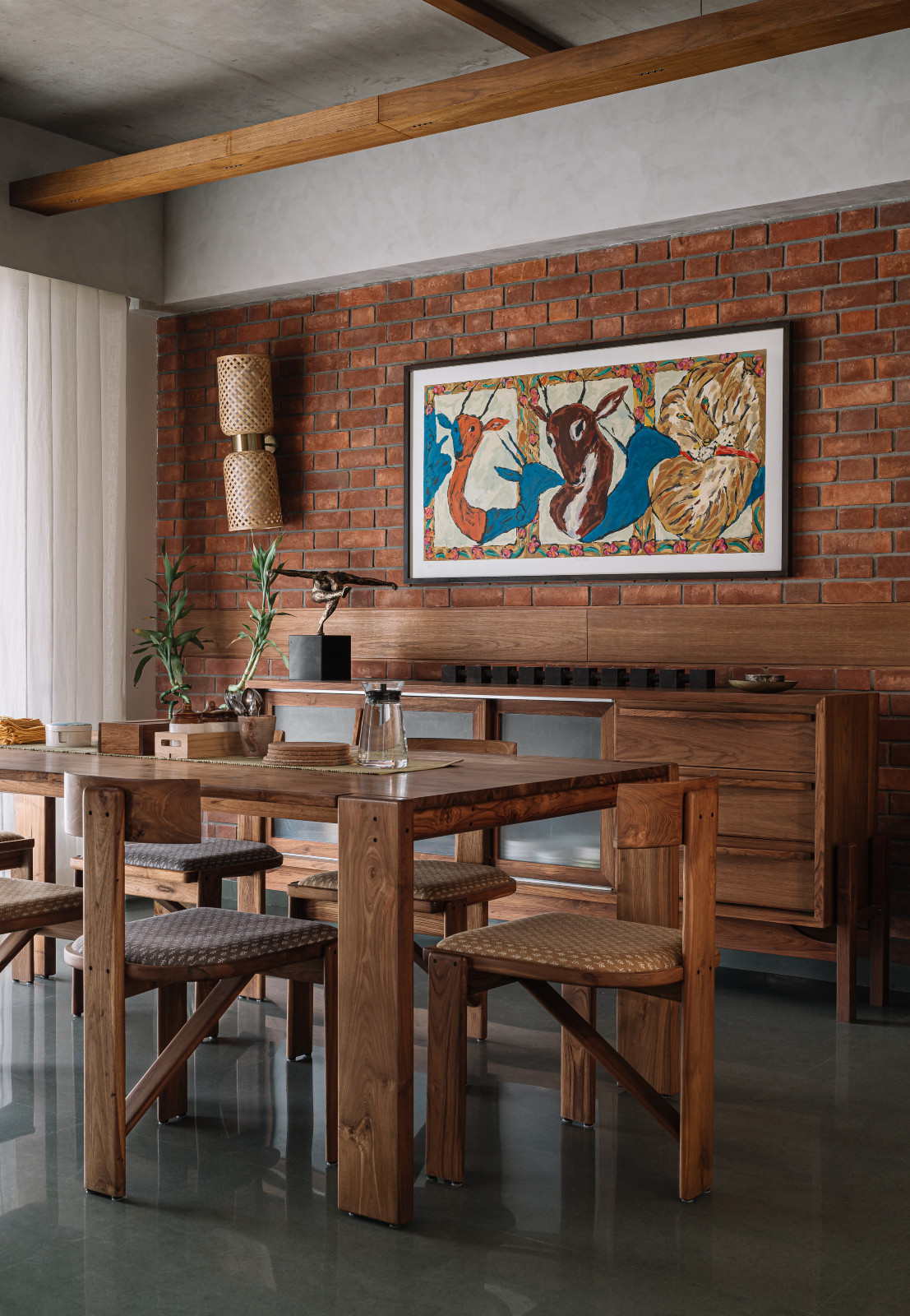 The dining area in a Corbusian-inspired family apartment in Ahmedabad, India, designed by Studio Saransh