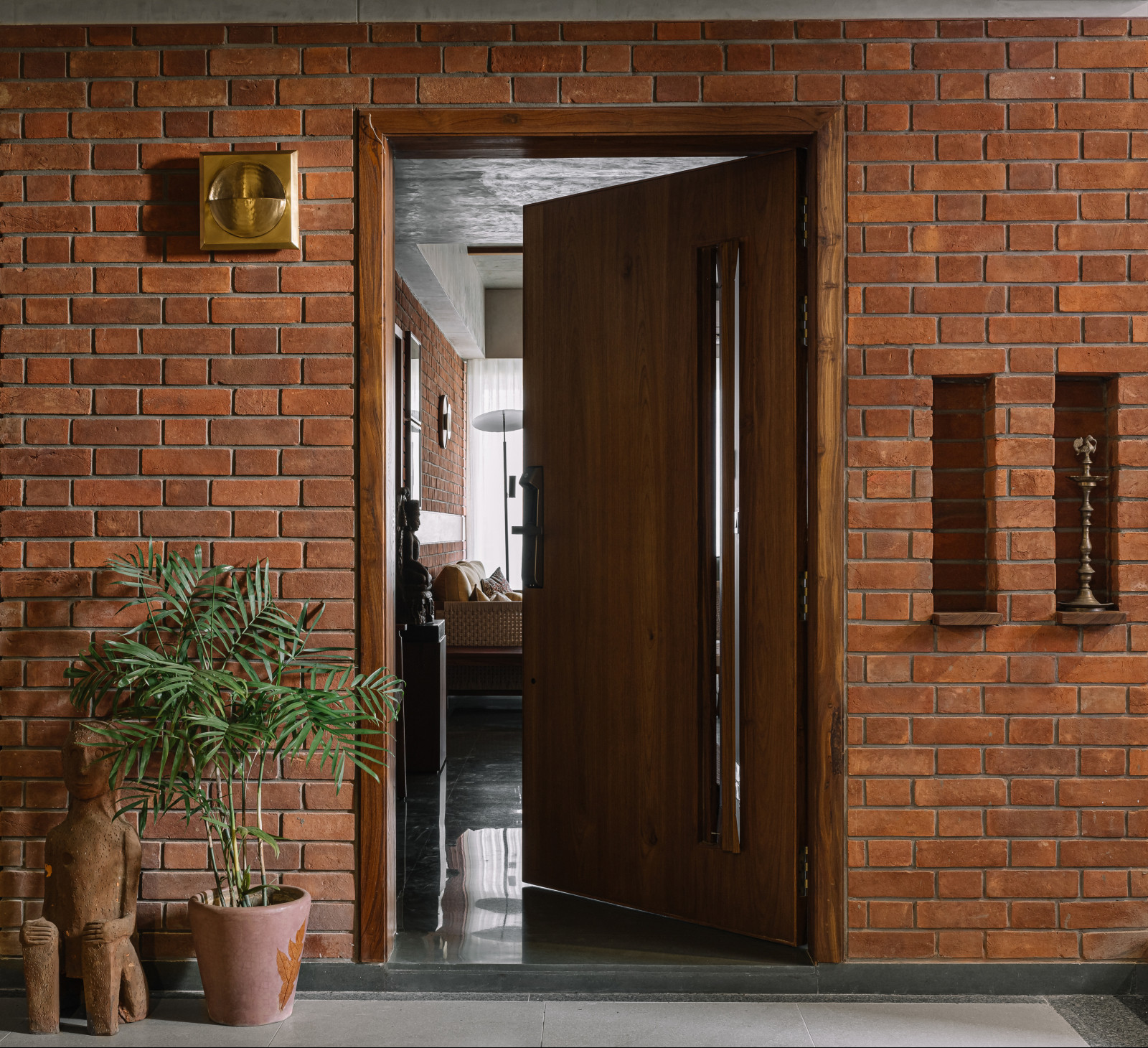 The entryway in a Corbusian-inspired family apartment in Ahmedabad, India, designed by Studio Saransh