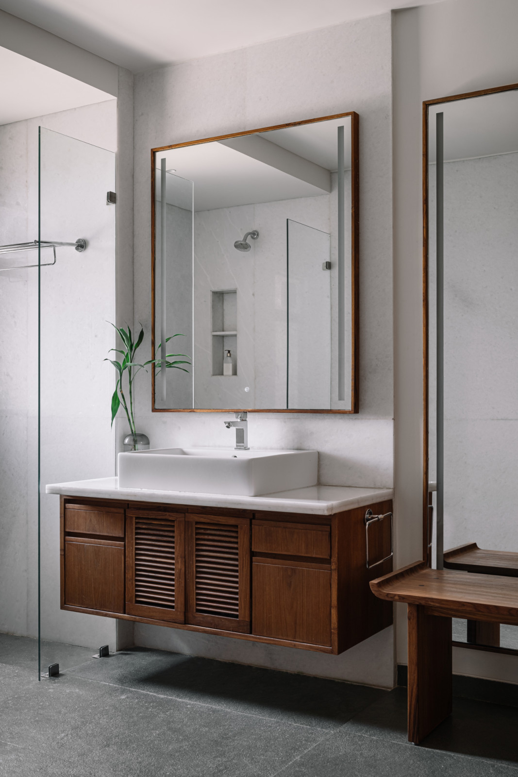 The primary bathroom in a Corbusian-inspired family apartment in Ahmedabad, India, designed by Studio Saransh