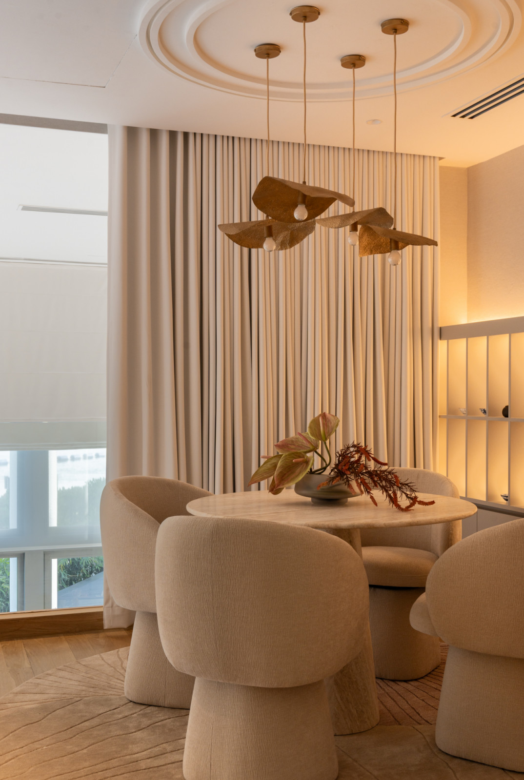 ARTG Design Group's Architology Interiors brings a considered intimacy to the upper-level dining nook adjacent to the unit's celebrated indoor Juliet balcony