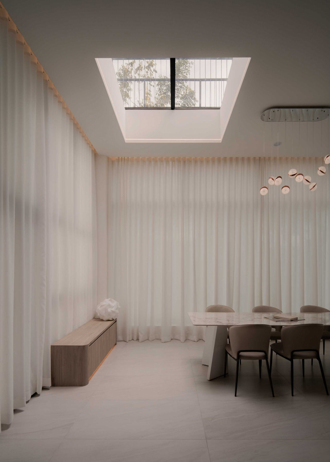 A skylight draws natural light into the dining area