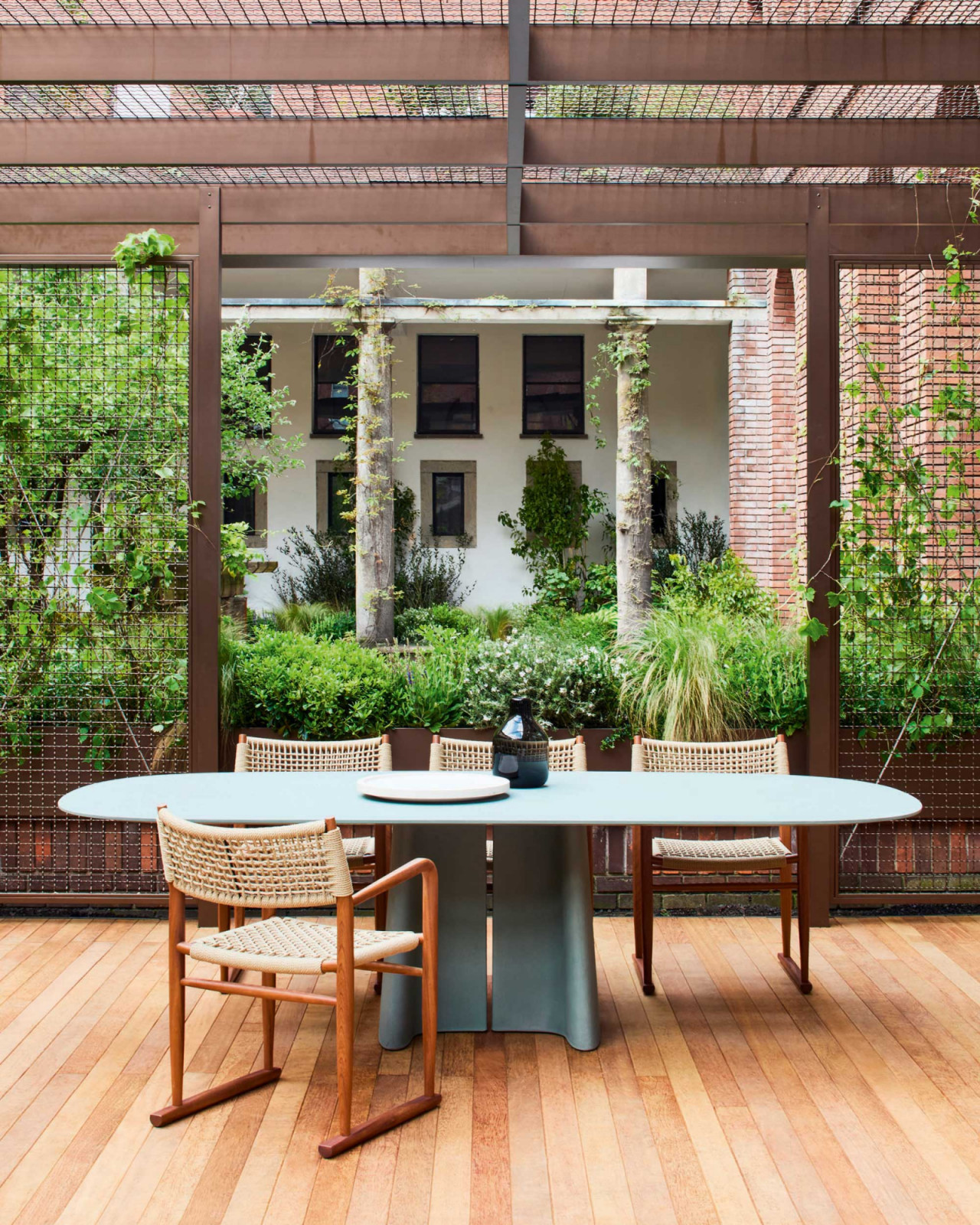Flexform’s Tara Outdoor concrete table by Sebastian Herkner, in powder blue