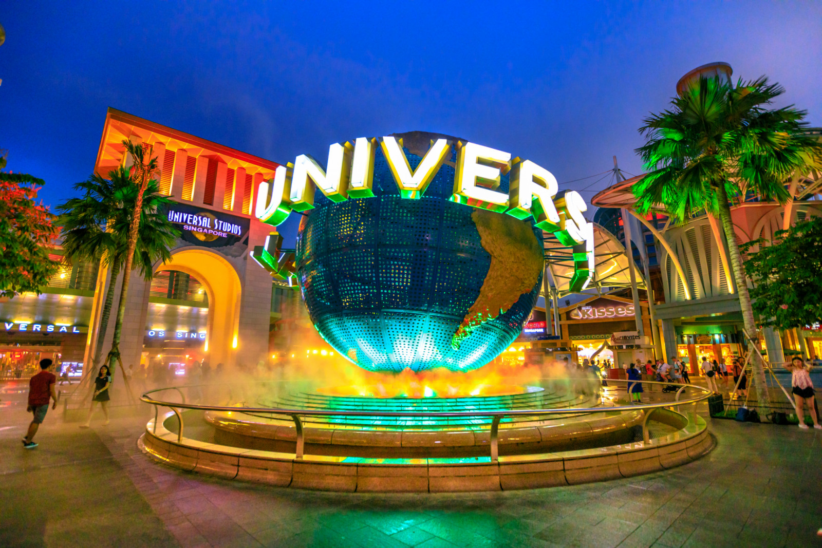 Singapore - May 2, 2018: Universal Studios world globe in green light, with tourists visiting this Hollywood movie theme park in Sentosa island. (Photo: bennymarty/Getty Images)