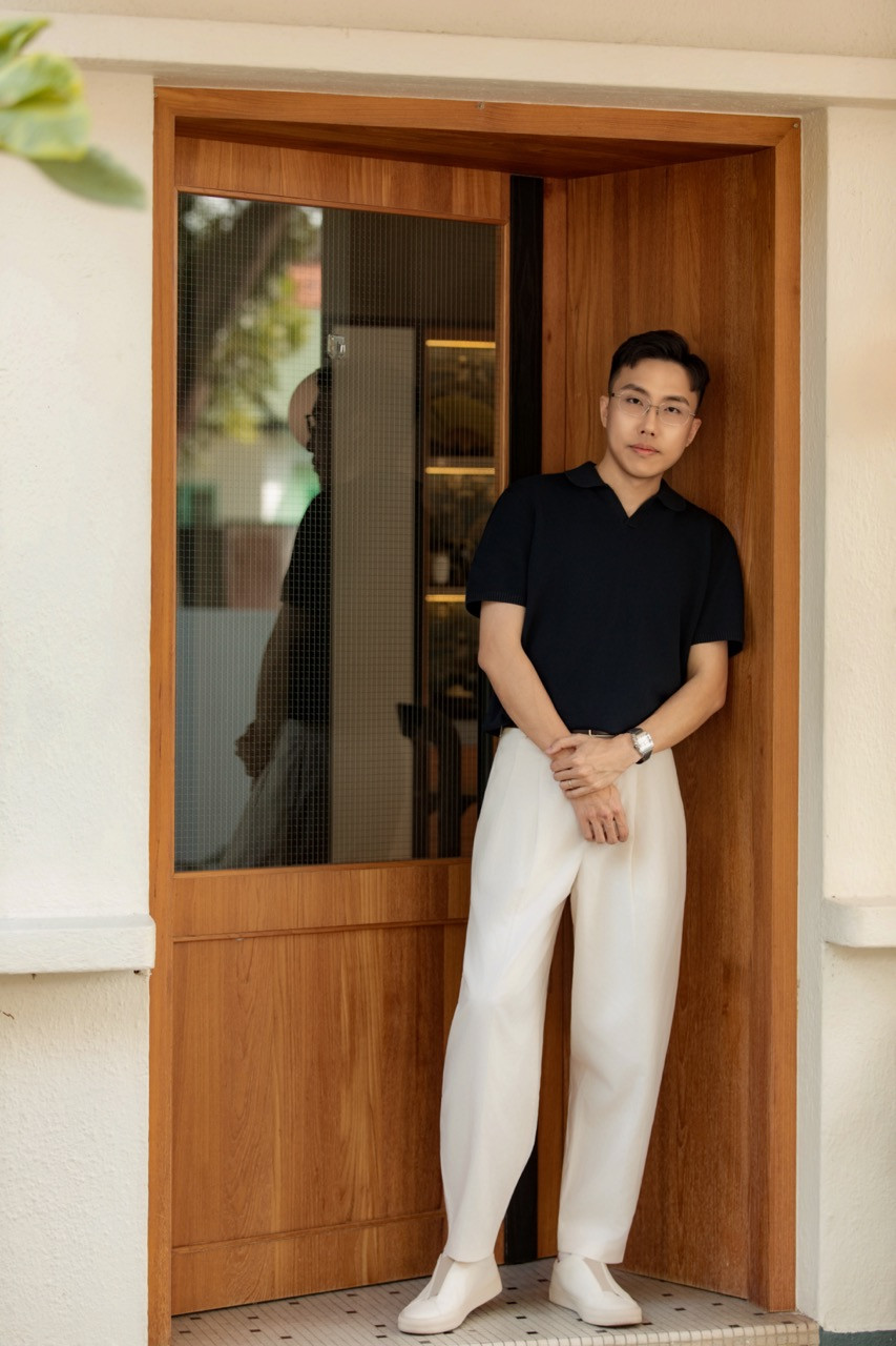 Edmund Ooi, founder of Strange Wu Studio, at the entrance of the 1962 semi-detached house in Tanjung Bungah