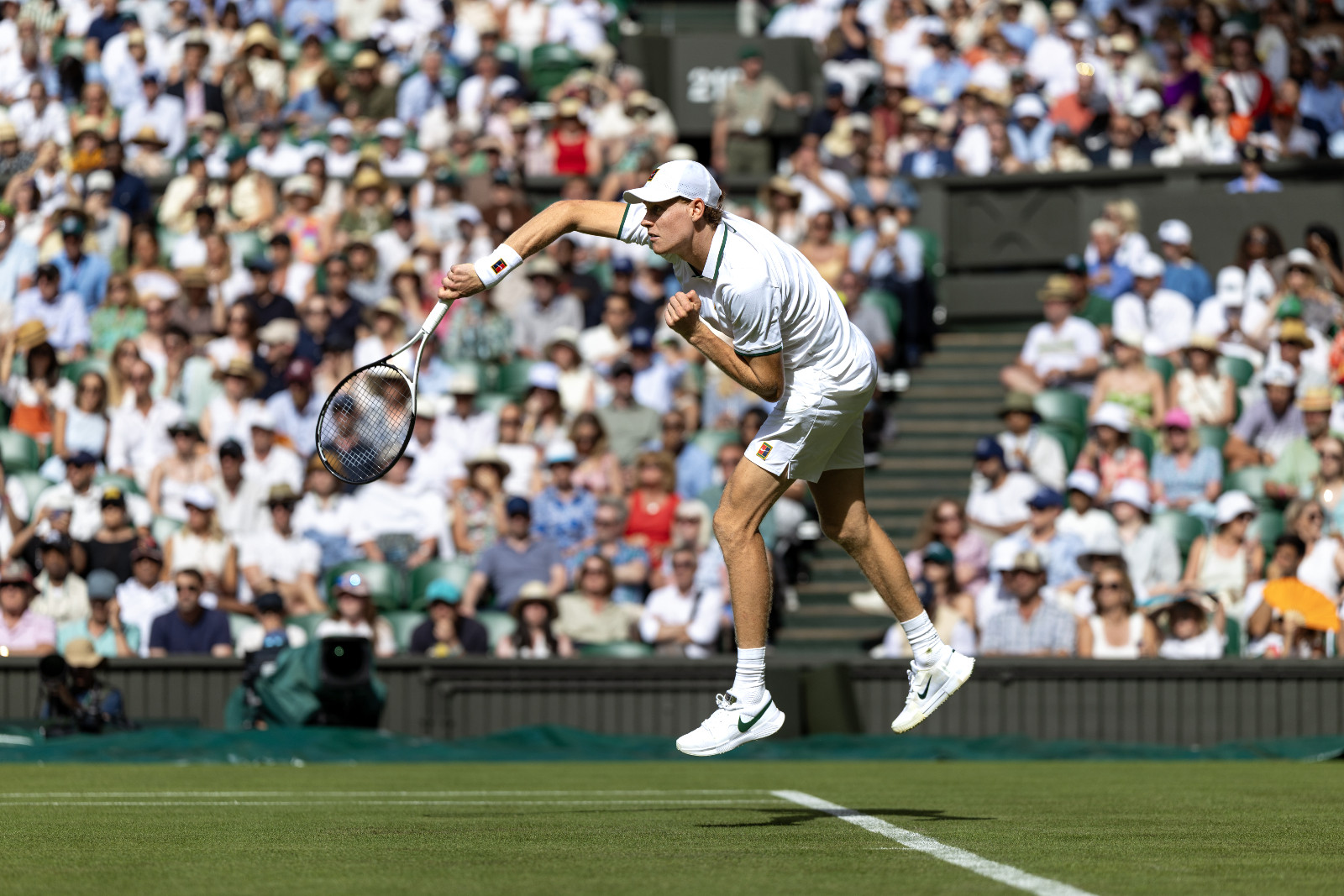 LONDON, ENGLAND - June 29: Jannik Sinner of Italy serves during his match against Miomir Kecmanovic of Serbia in the first round of the Gentlemen's Singles Competition on Centre Court during the Wimbledon Lawn Tennis Championships at the All England Lawn Tennis and Croquet Club at Wimbledon on June 29th, 2026, in London, England. (Photo by Tim Clayton/Getty Images)