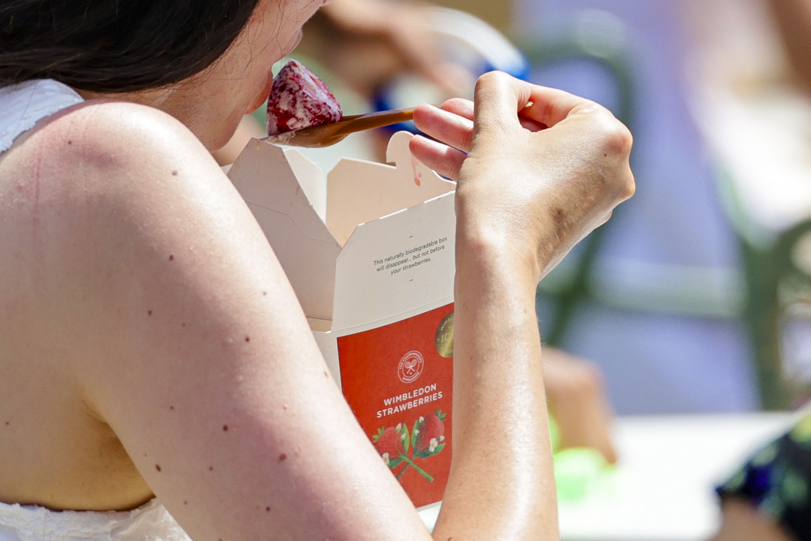 01 July 2025, Great Britain, London: Tennis: Grand Slam/WTA Tour/ATP Tour, Wimbledon. A woman eats a strawberry. Served with clotted cream, strawberries are a traditional and integral part of the tennis Grand Slam at Wimbledon. Photo: Frank Molter/dpa (Photo by Frank Molter/picture alliance via Getty Images)