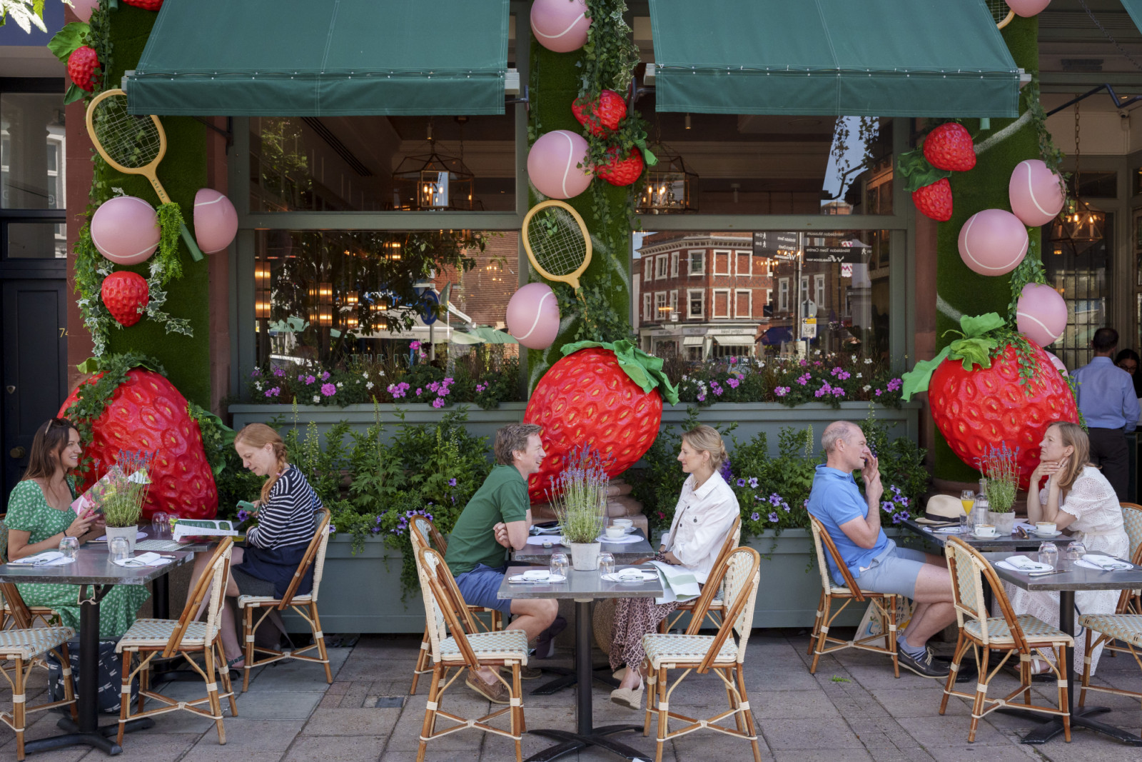 A cafe has a tennis championship strawberry theme in Wimbledon village during the second week of the Wimbledon Tennis championships, on 9th July 2025, in London, England. (Photo by Richard Baker / In Pictures via Getty Images)