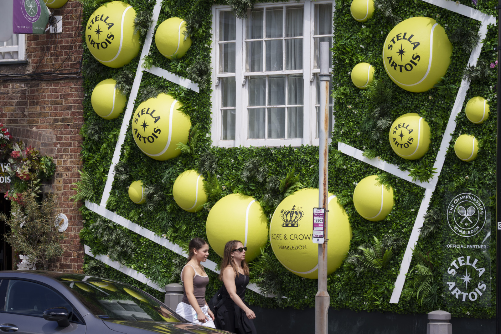 On the first day of the two-week Wimbledon tennis tournament, the Rose & Crown pub has its traditional tennis ball-themed street exterior display in Wimbledon Village, on 29th June 2026, in London, England. The Belgian brewery Stella Artois is a major sponsor of the 2026 Wimbledon tennis championships, their branding present in many pubs and cafes. (Photo by Richard Baker / In Pictures va Getty Images)