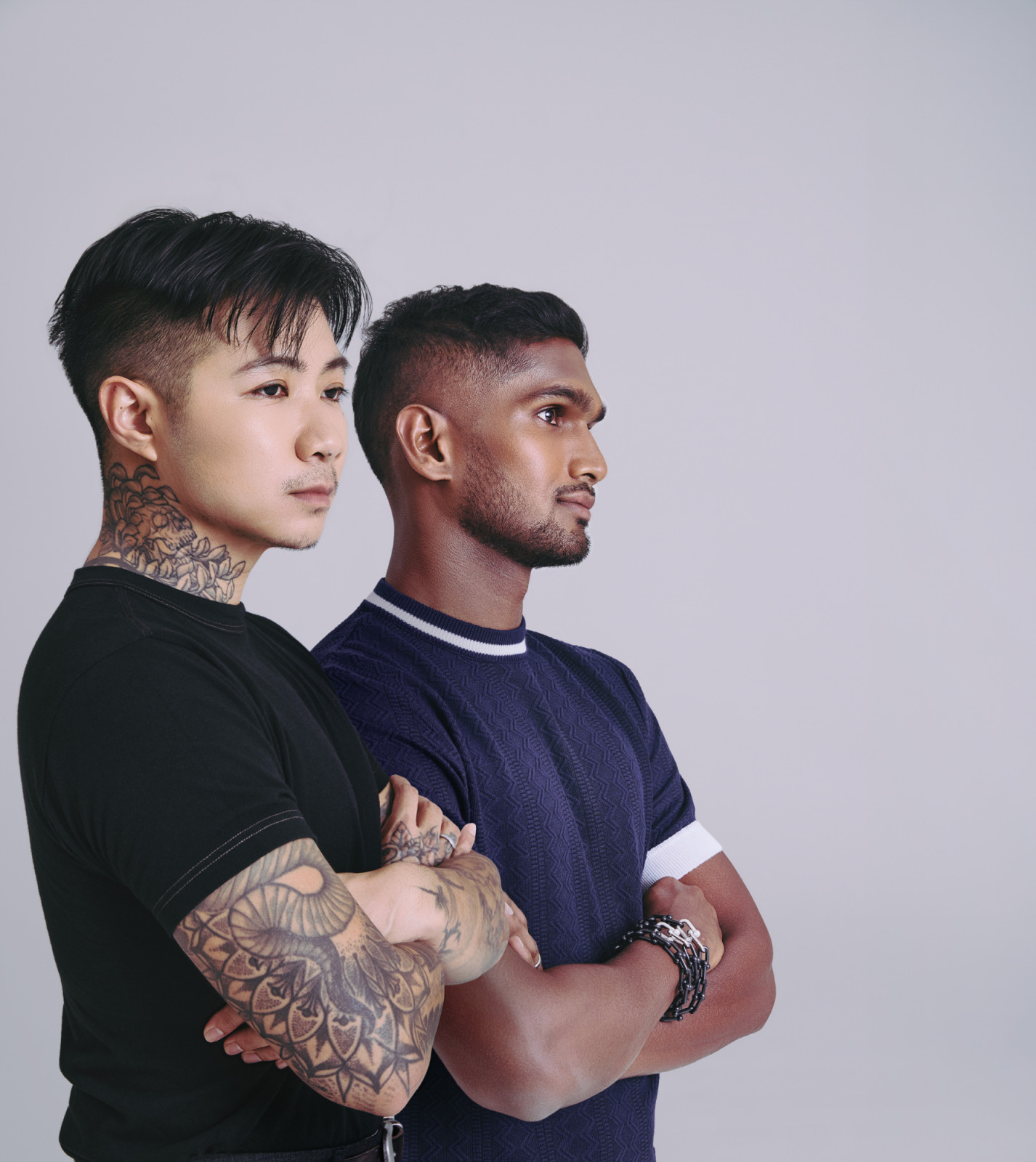 Artist Sam Lo and national footballer Hariss Harun. Hariss wears Tiffany & Co HardWear large link necklace and bracelet (worn together as bracelet) in titanium and platinum set with diamonds