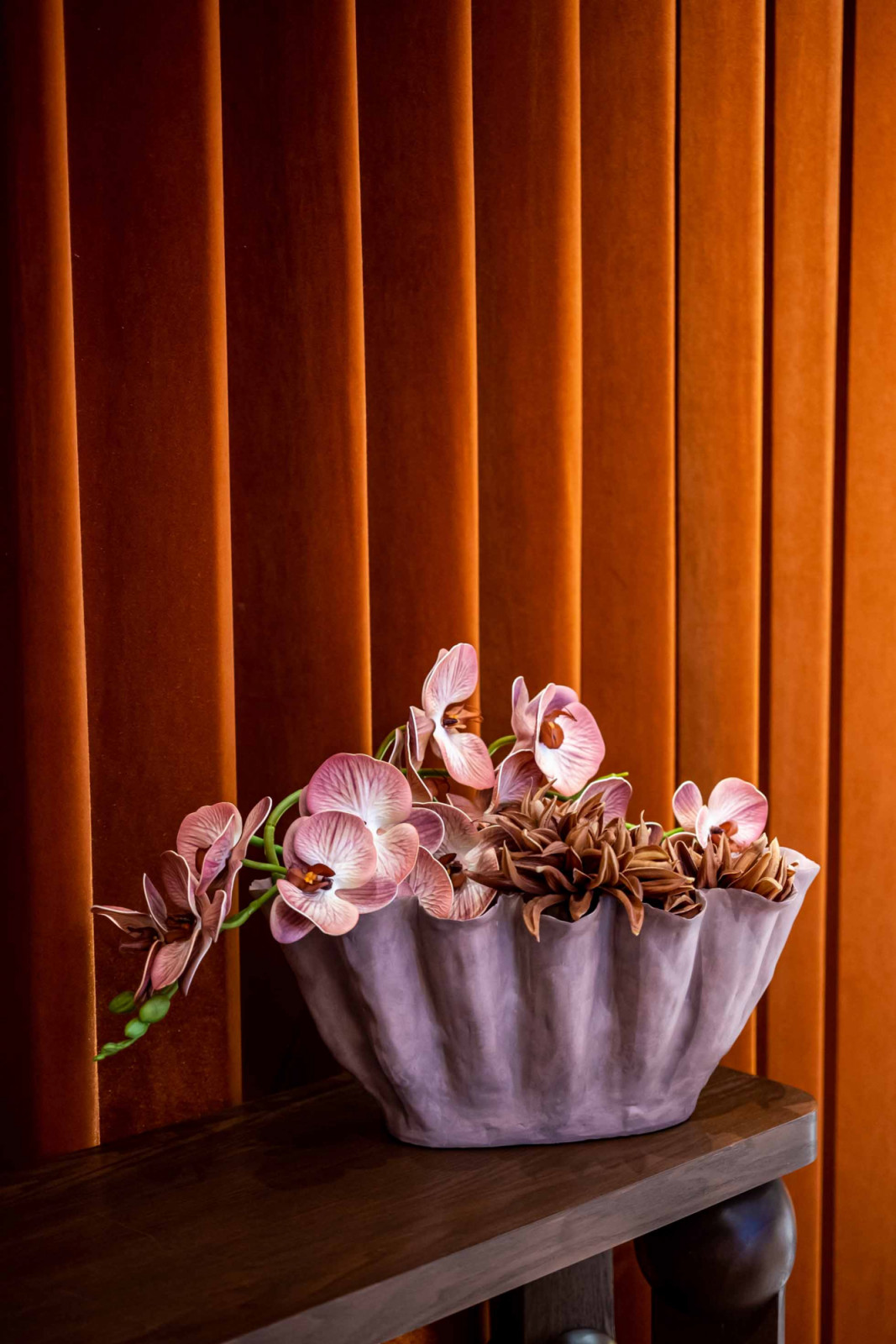 Atelier V&A floral arrangement with Coesa’s velvet curtain