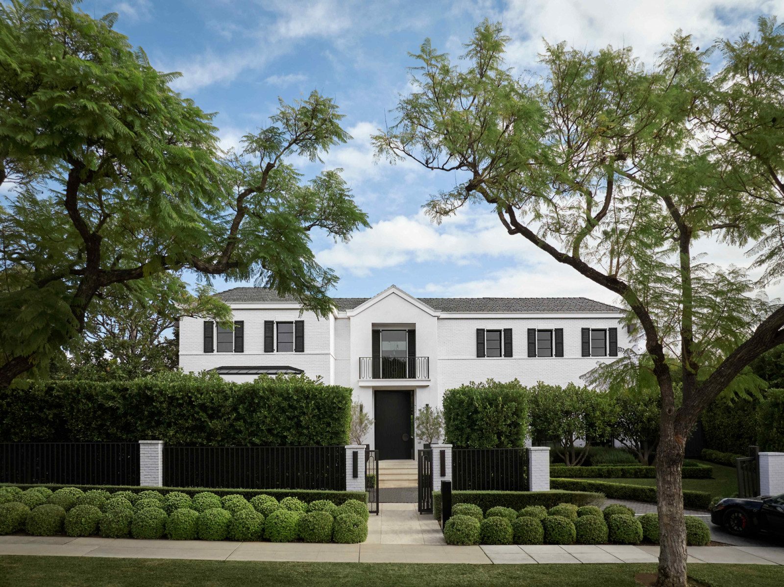 The home is located in a neighbourhood with mature landscaping, layered topography, and a gentler rhythm