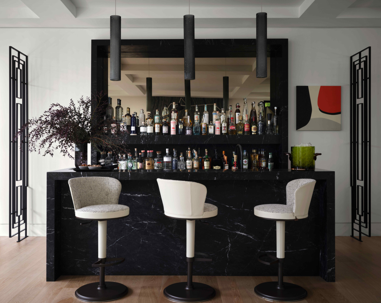 A custom back bar has been seamlessly integrated into the architecture