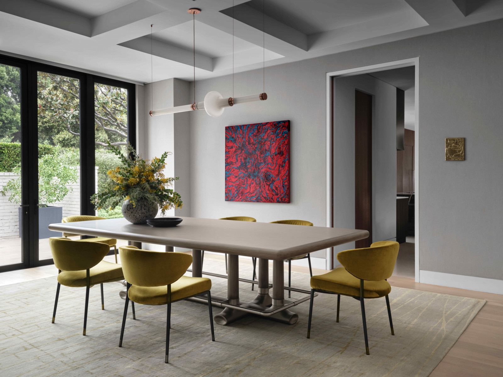 The formal dining room makes a bolder impression with a material-driven narrative