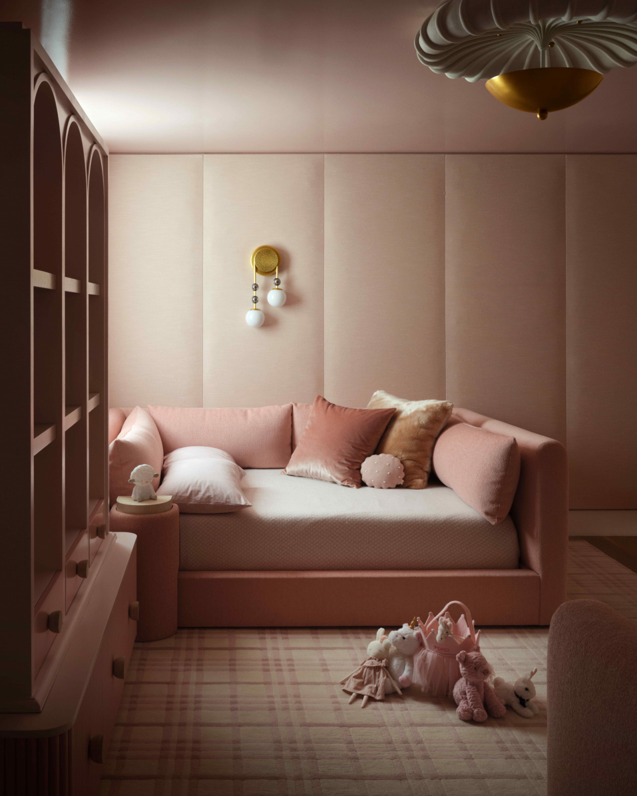 Padded wall panels with a Volker Haug wall sconce and a Stark Carpet rug