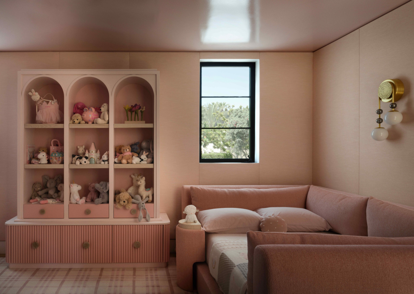 The children’s playroom remains deeply connected to the architecture
