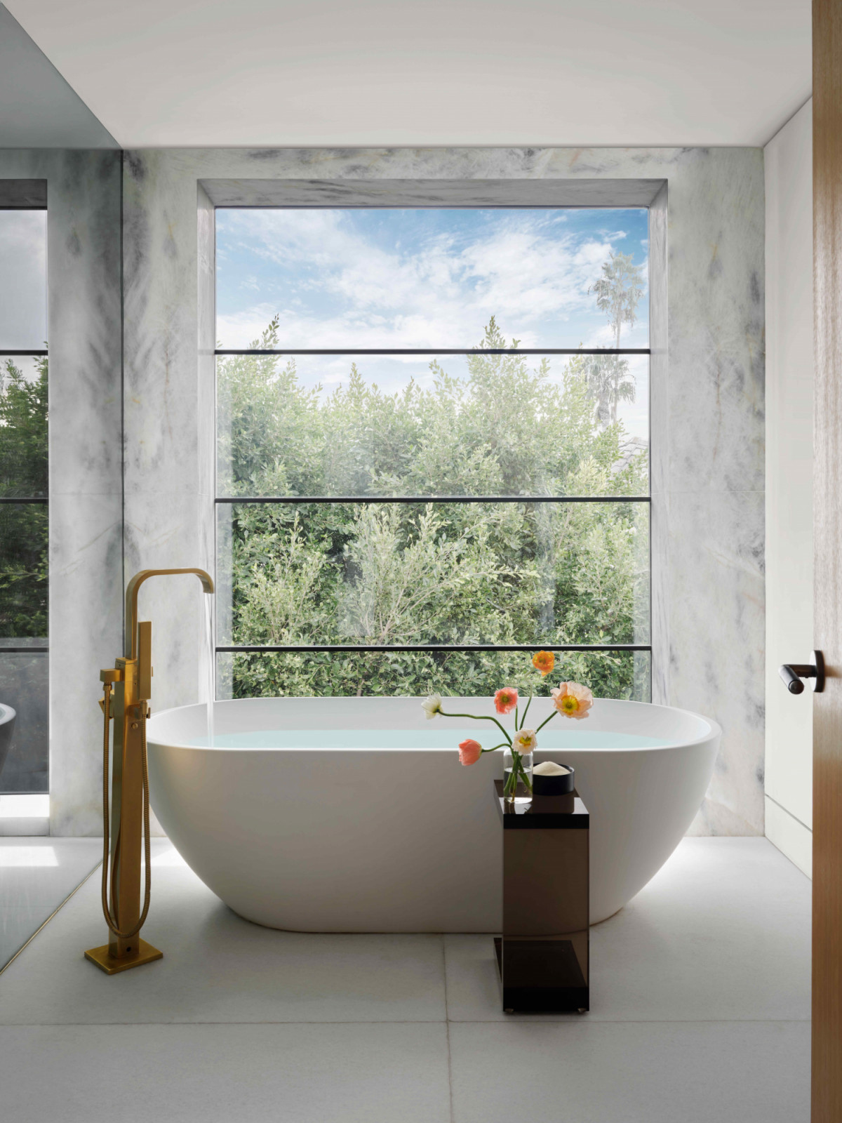The light-filled primary bathroom