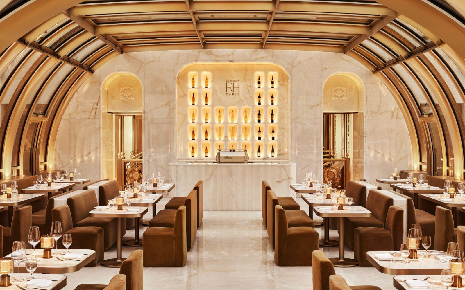 Le Jardin RH occupies a domed dining room lined in veined marble, its ceiling framed in bronze glazing bars (Photo: Kristen Pelou)
