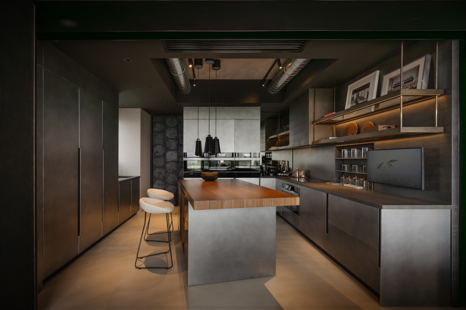 In the Binova kitchen, the client-conceived diagonal placement of the central island plays against the sleek cabinetry