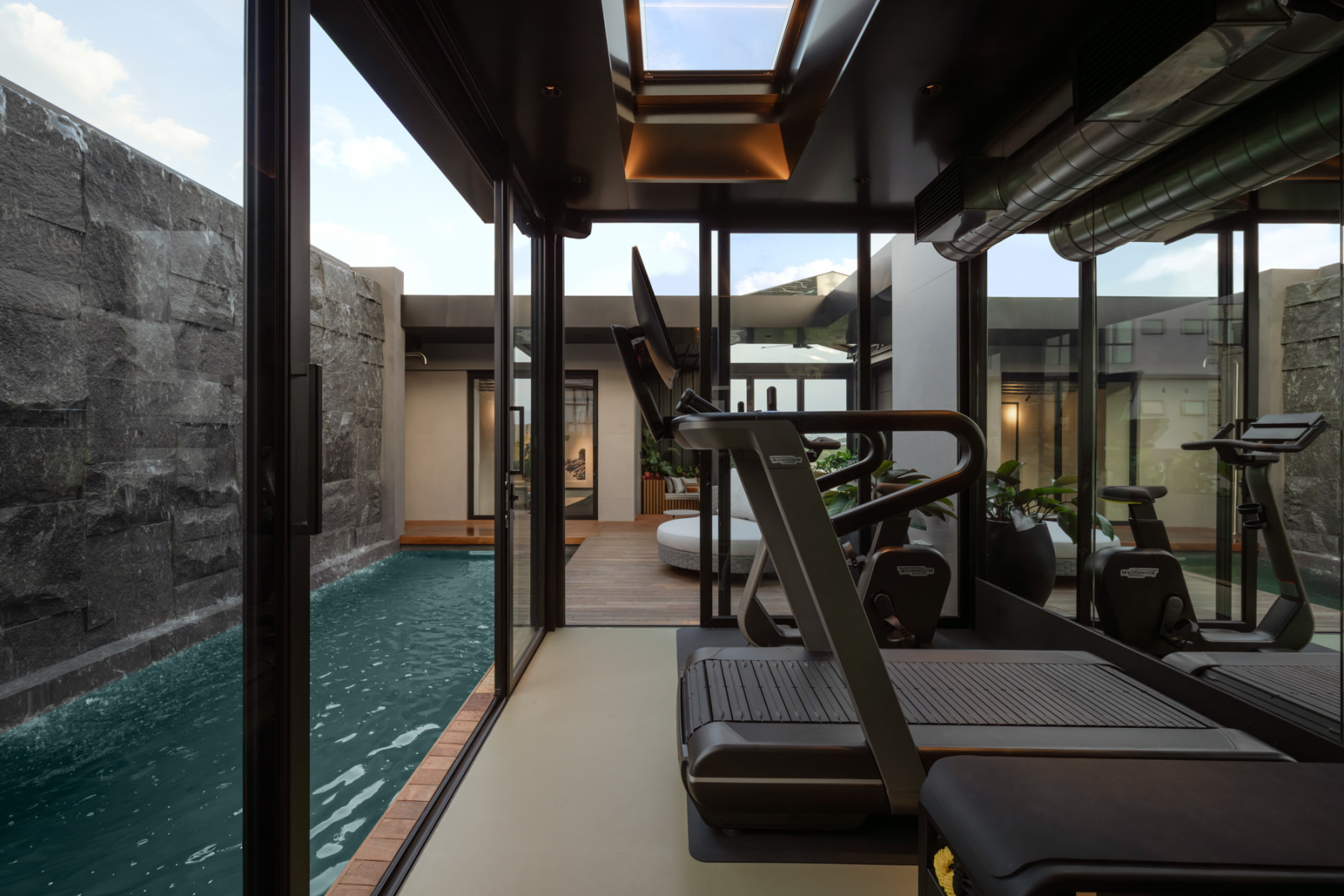 The glass-box gym pavilion on the rooftop