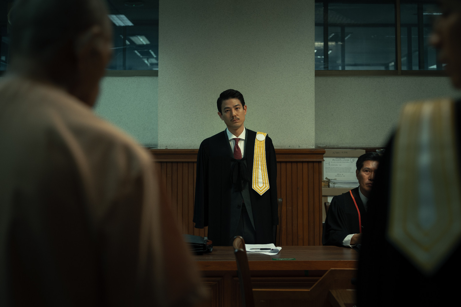 The Evil Lawyer. Paopetch Charoensook (เผ่าเพชร เจริญสุข) as Techin Methaneepaisal (เตชิน เมทนีไพศาล)
in The Evil Lawyer Cr. Cai Lian Jie © 2026 Netflix