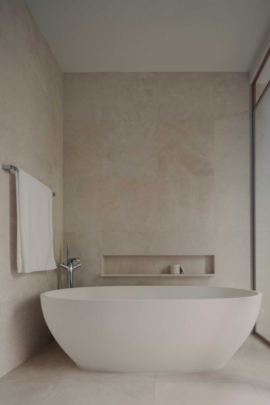 Tactile surfaces in the bathroom create a soothing atmosphere