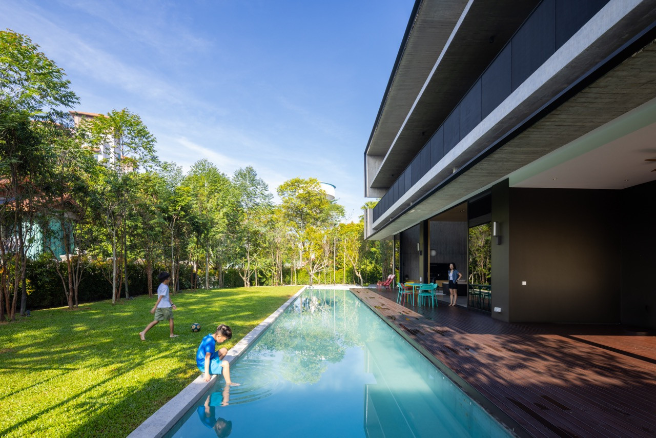 The lap pool marks the division between the built structure and the garden, a threshold the clients’ children cross daily