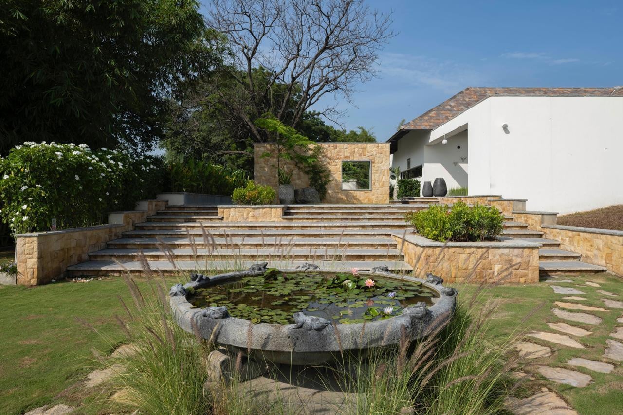 High walls create a sense of anticipation, revealing the residence in stages