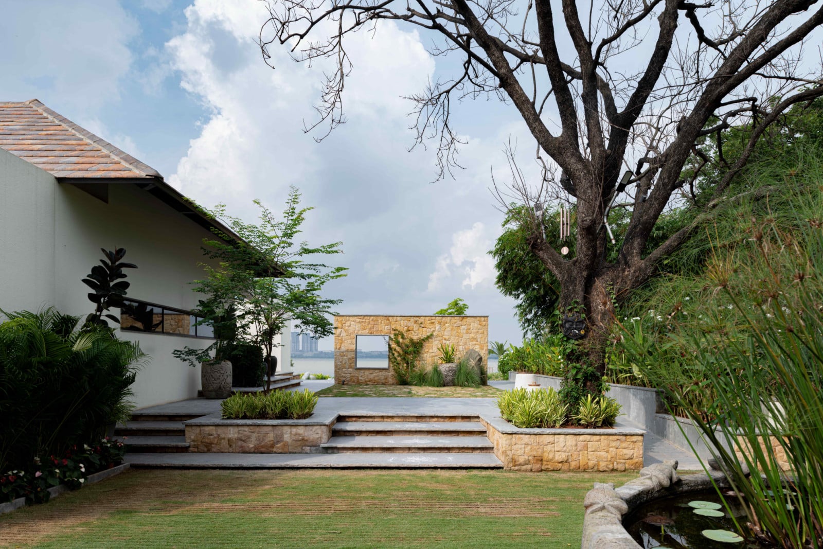 Directional walls and pathways offer fleeting glimpses of the lake