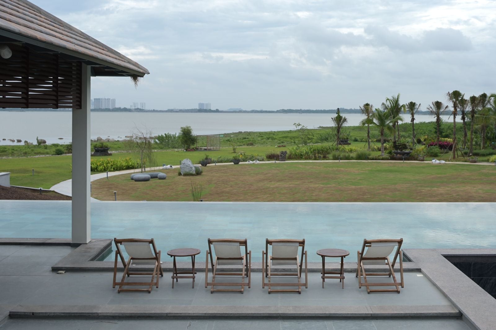 Swimming pools are integrated discreetly into the lush landscape