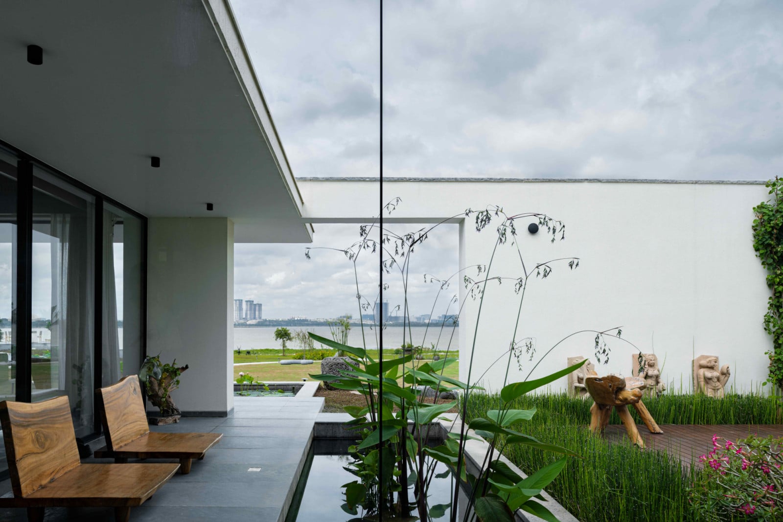 Fleeting glimpses of the lake seen through floor-to-ceiling glazing