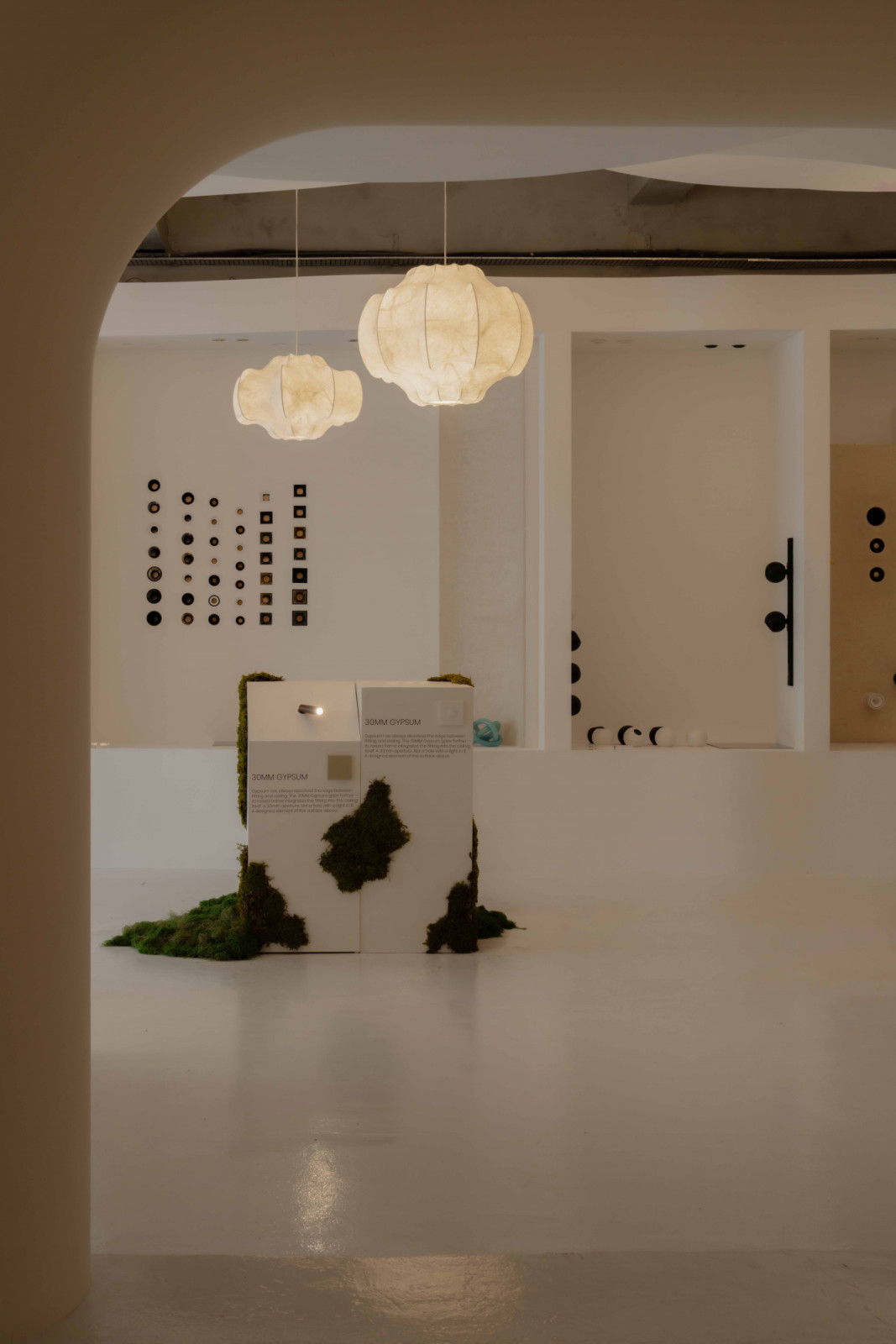 Inside The Hour of Light at Sol Luminaire, with the Aeon 30MM Gypsum presented among the showroom’s arched interior