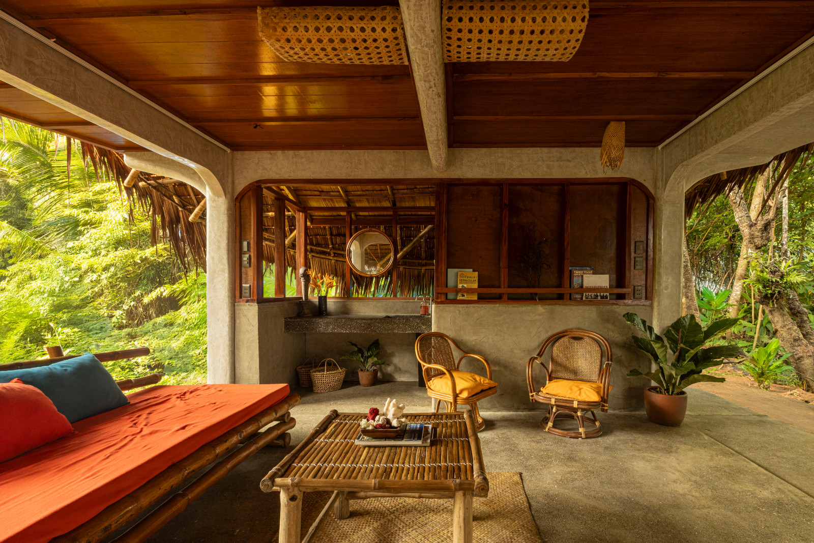 A self-contained guest cabana organised around semi-outdoor living, the unit includes a private bathroom, kitchenette, lounge, and upper-level bedroom, designed around natural ventilation and cross-flow airflow.