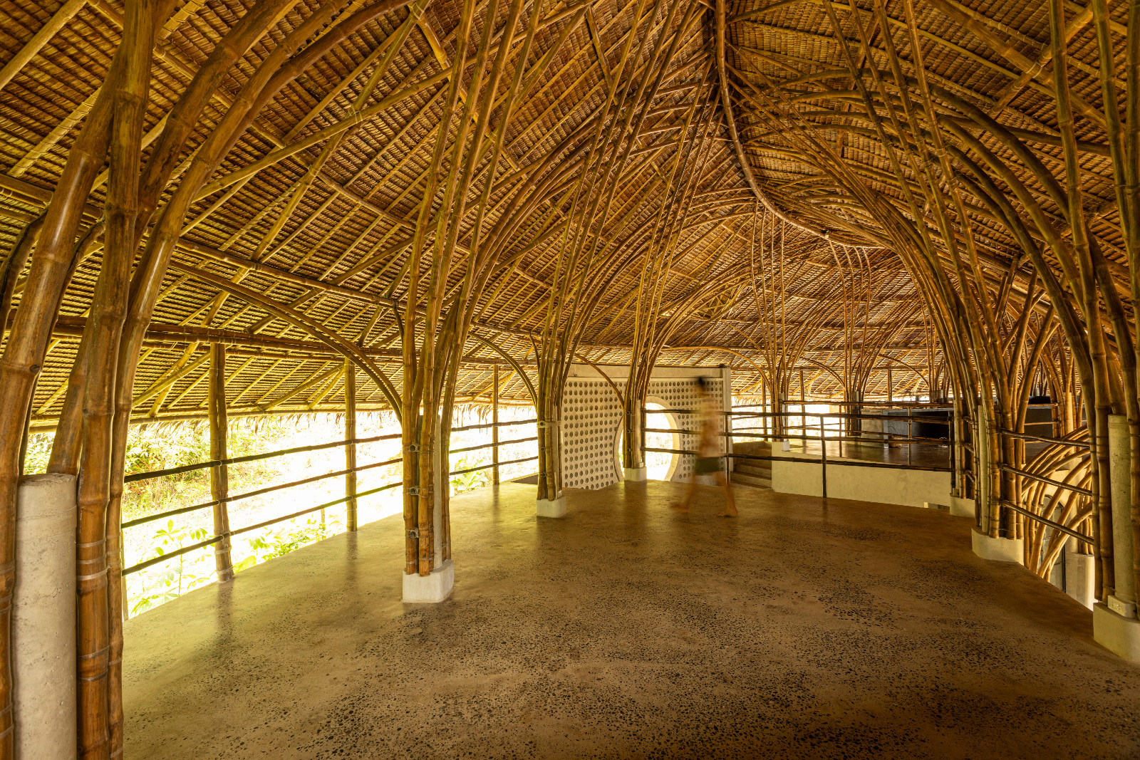 House Formo is a three-bedroom villa organised around a circular plan, built using approximately 1,600 bamboo (bayog) and a 5,000-piece pawid roof. Designed for typhoon resilience and natural ventilation, the house operates without air-conditioning