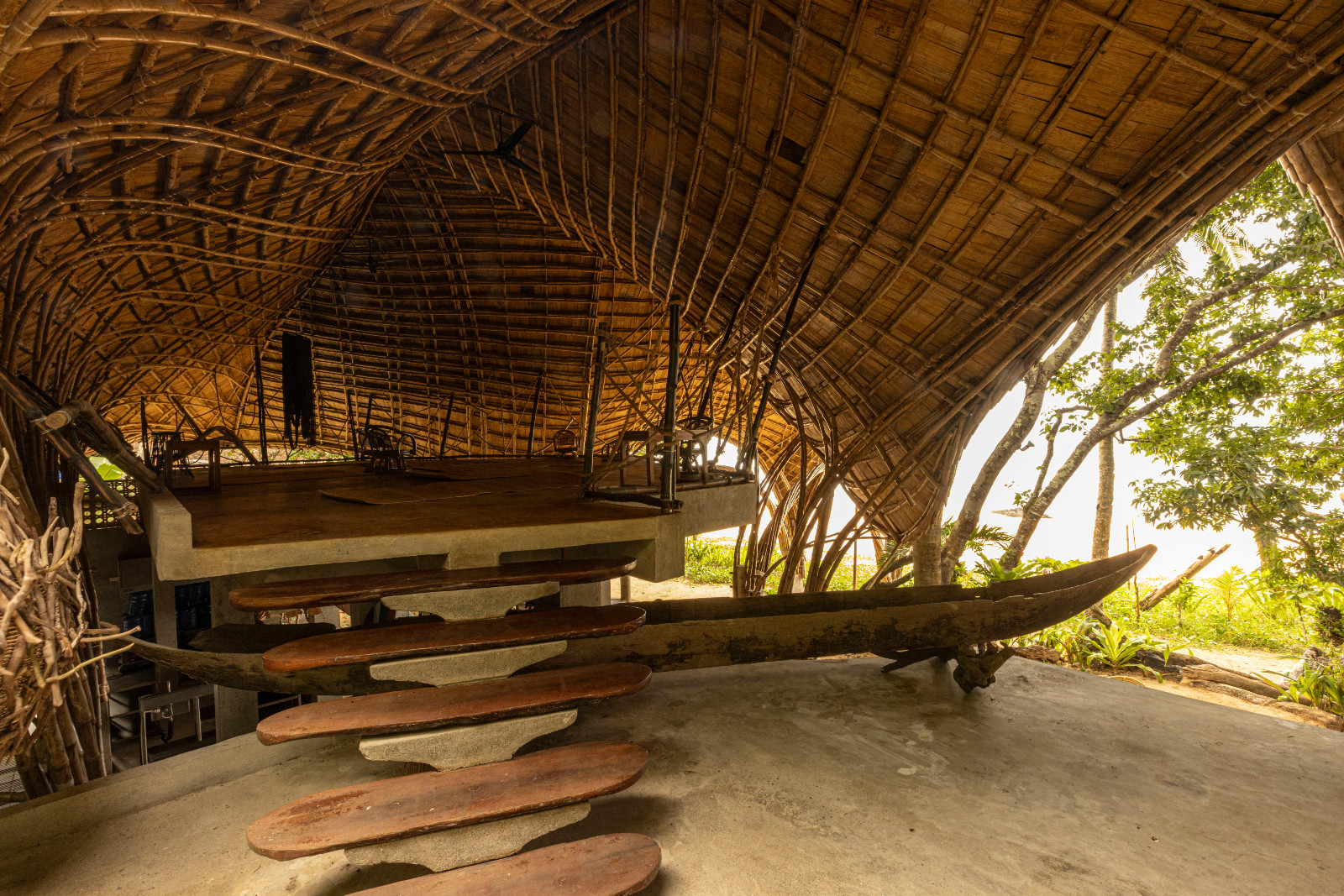 Taran Beach Club is a surf, wellness, and hostel destination built on a remote coastal site accessible only by sea for the transportation of materials during parts of the year
